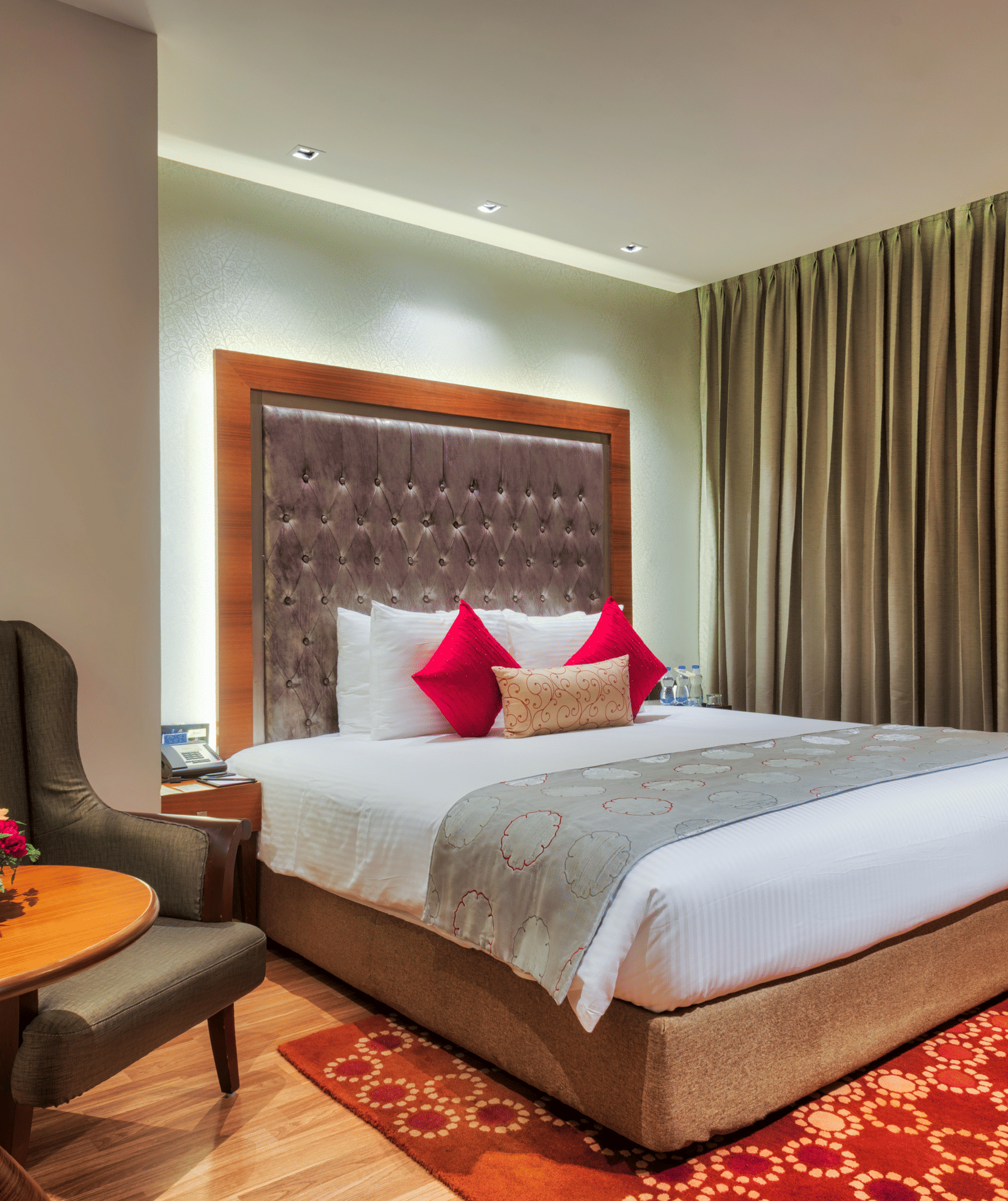 View of the king size bed of a Deluxe Suite at at Grand Chennai By GRT Hotels.