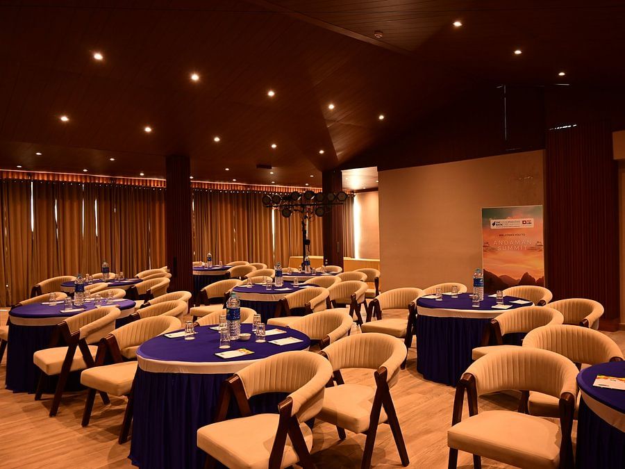 Elegant banquet hall with round tables and warm lighting setup at Silver Sand Beach Resort, Havelock