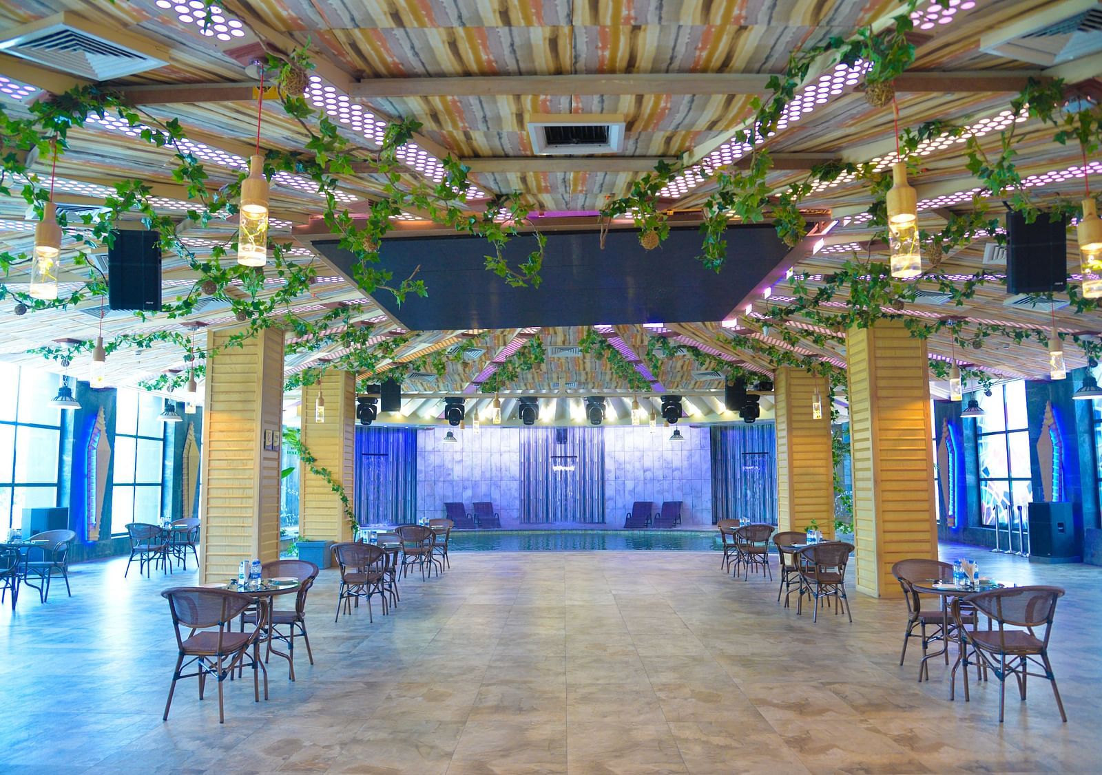 A well decorated restaurant featuring several chairs and tables - Golden Blossom Imperial Resorts, Lucknow