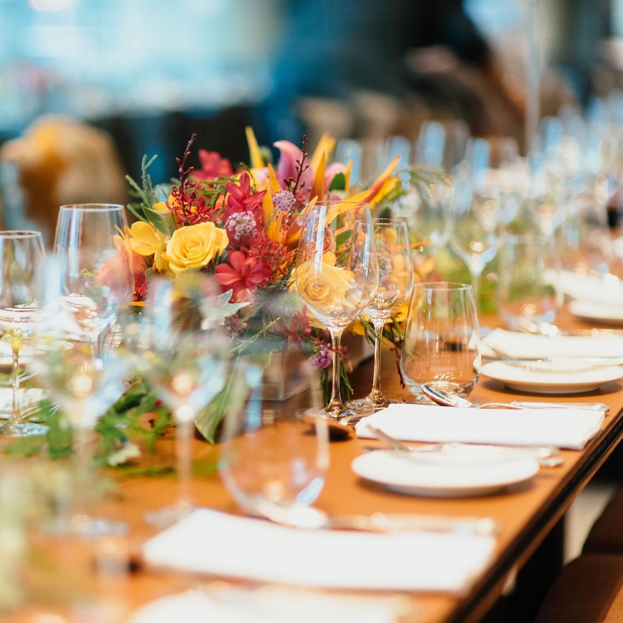 a table with tableware and glasses set during an event