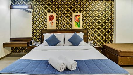 A royal executive room in Krushnai Resort with a double bed and modern interiors.