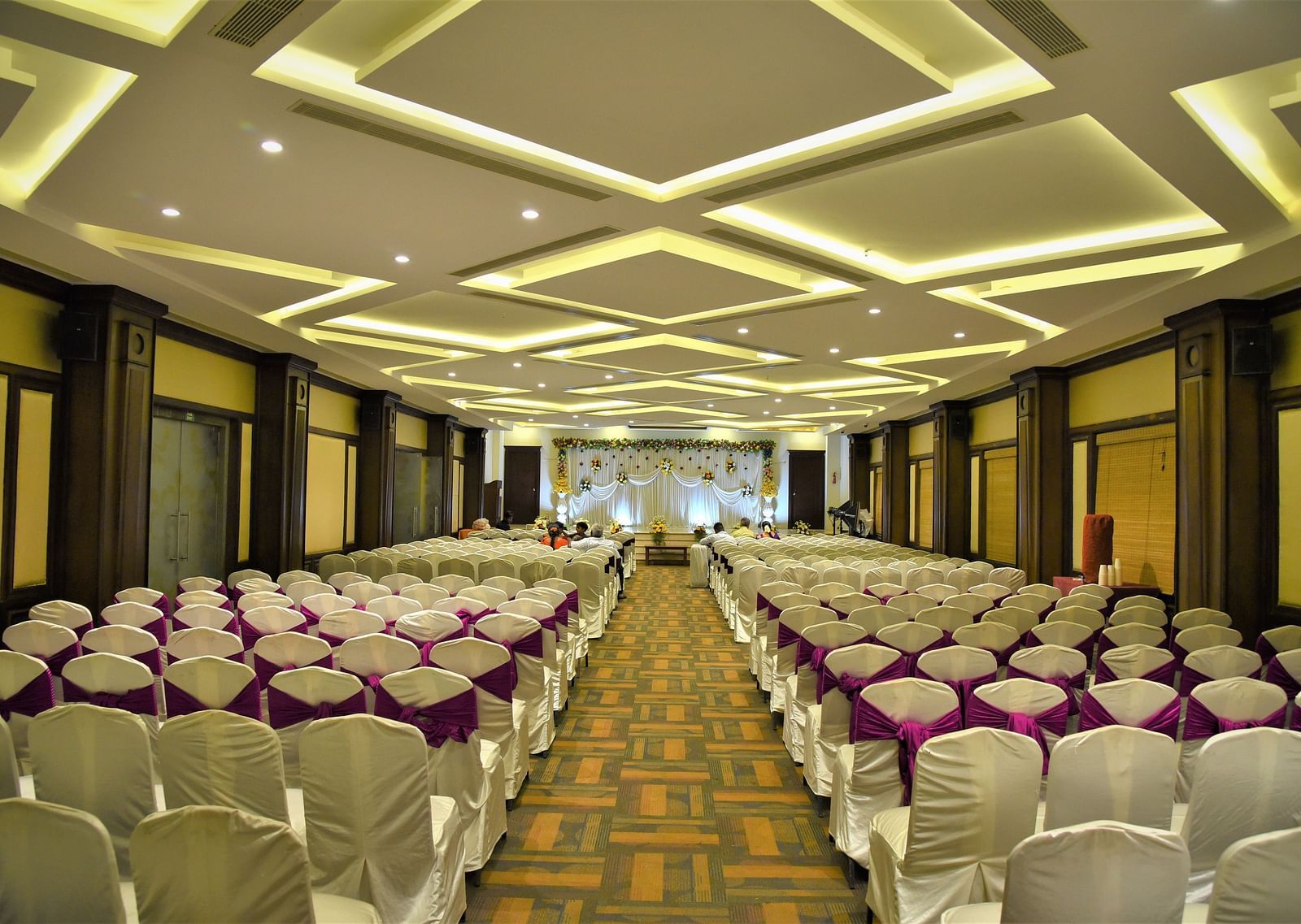 A meeting hall with a classroom seating arrangement