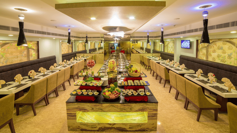 A seating area at Quintessence Restaurant in Chennai - Hotel Raj Park, Chennai