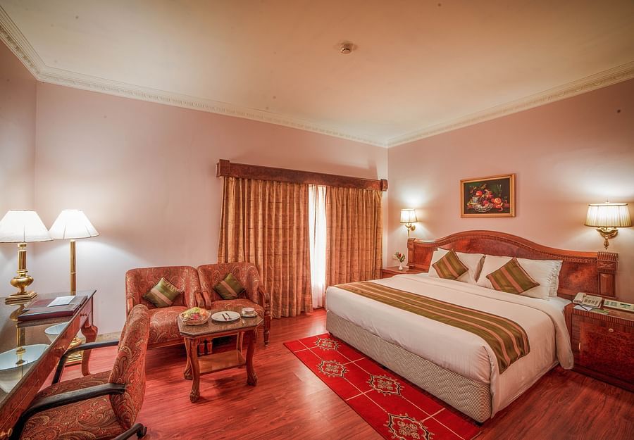 a double bed inside one of the Rooms at Raj Park Hotel in Alwarpet, Chennai