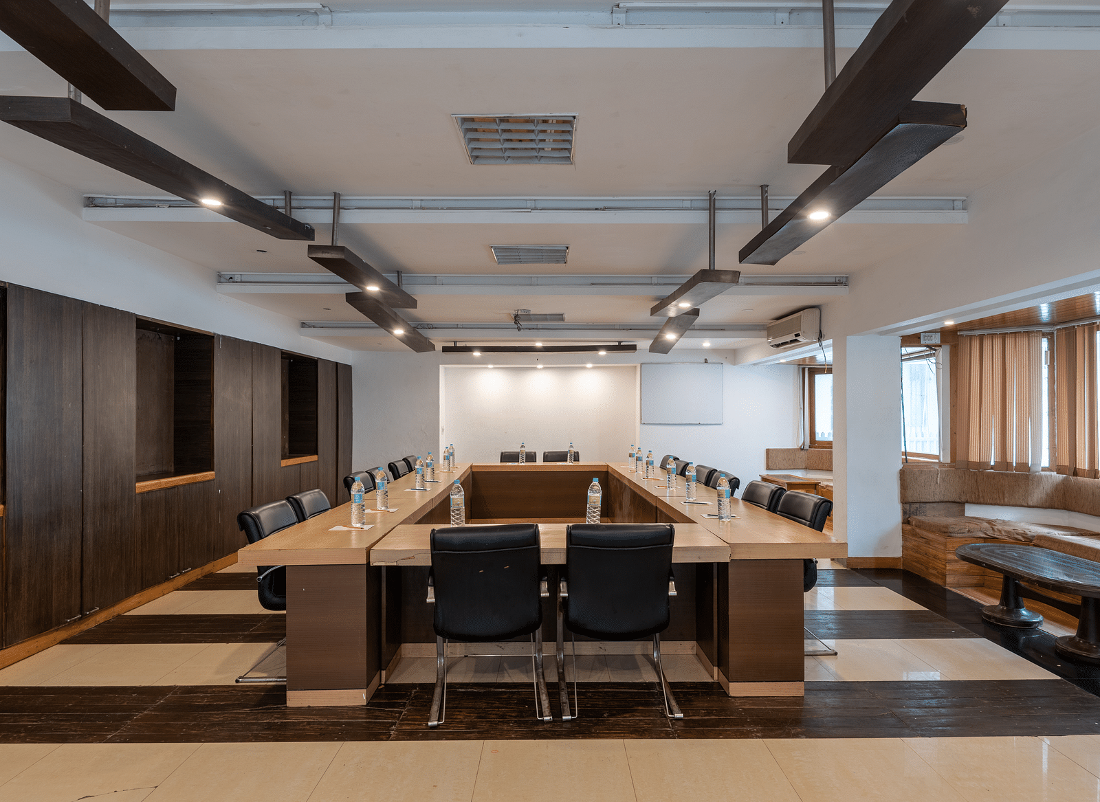 Conference Hall  at DLS Spring Valley Resort Dharamshala  with chairs and tables arranged in boardroom setting 