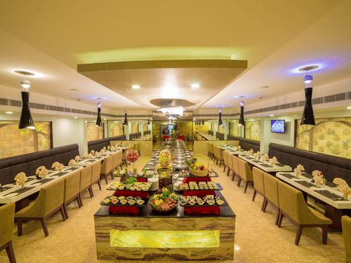 A seating area at Quintessence Restaurant in Chennai - Hotel Raj Park, Chennai