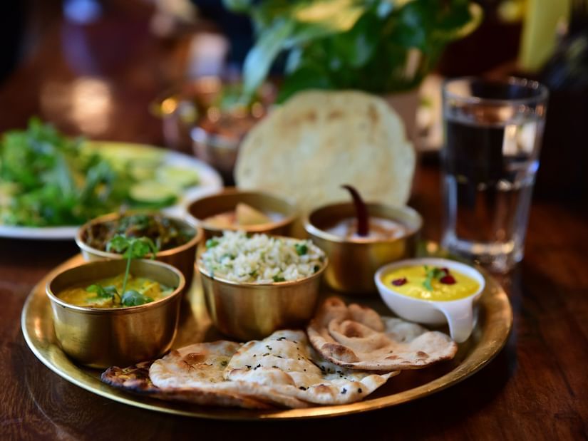 closeup-shot-indian-tasty-food-called-marwari-veg-thali-wooden-table