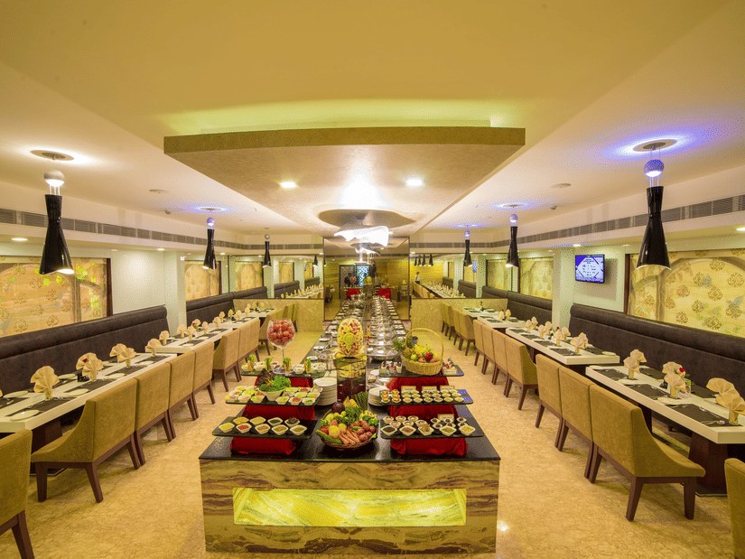 A seating area at Quintessence Restaurant in Chennai - Hotel Raj Park, Chennai