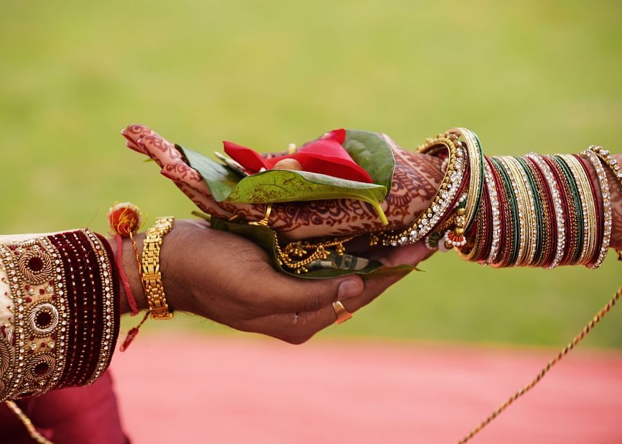 groom and bride holding hands during a wedding ceremony