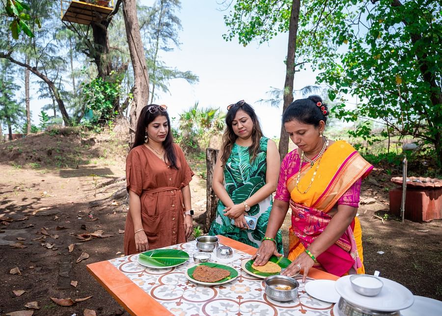 Lotus Eco beach resort, wadi restaurant 3 women preparing food on banana leaf