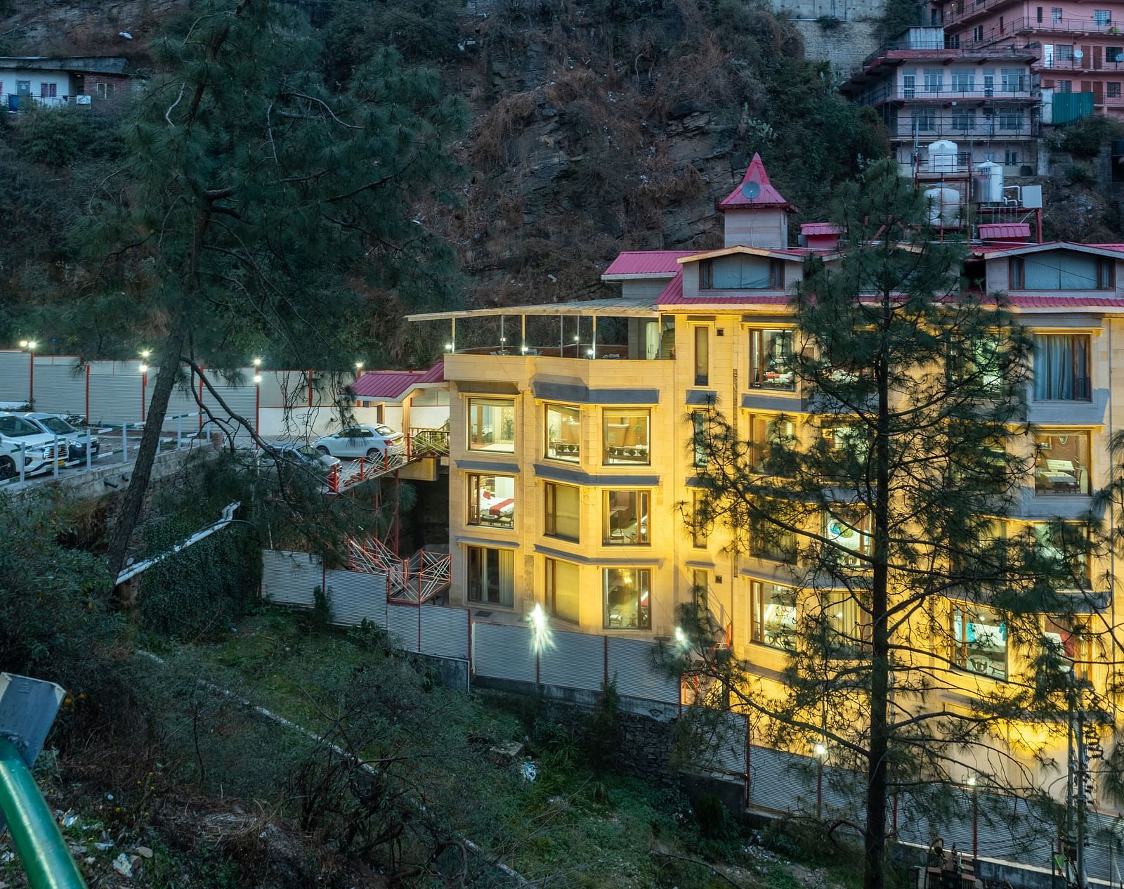 exterior view of the DLS Rock Castle illuminating yellow lights in the evening.
