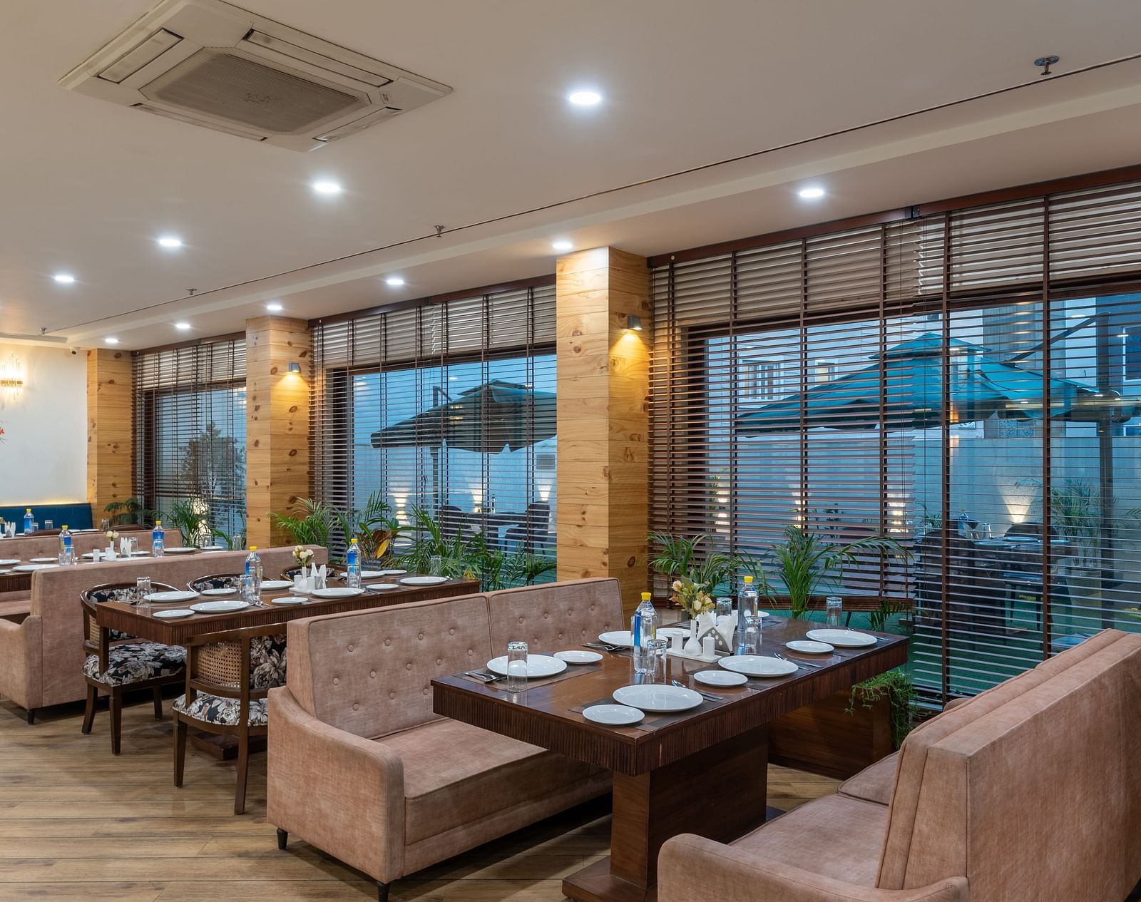 Seating area of a restaurant featuring multiple sofas arranged at DLS The Classio