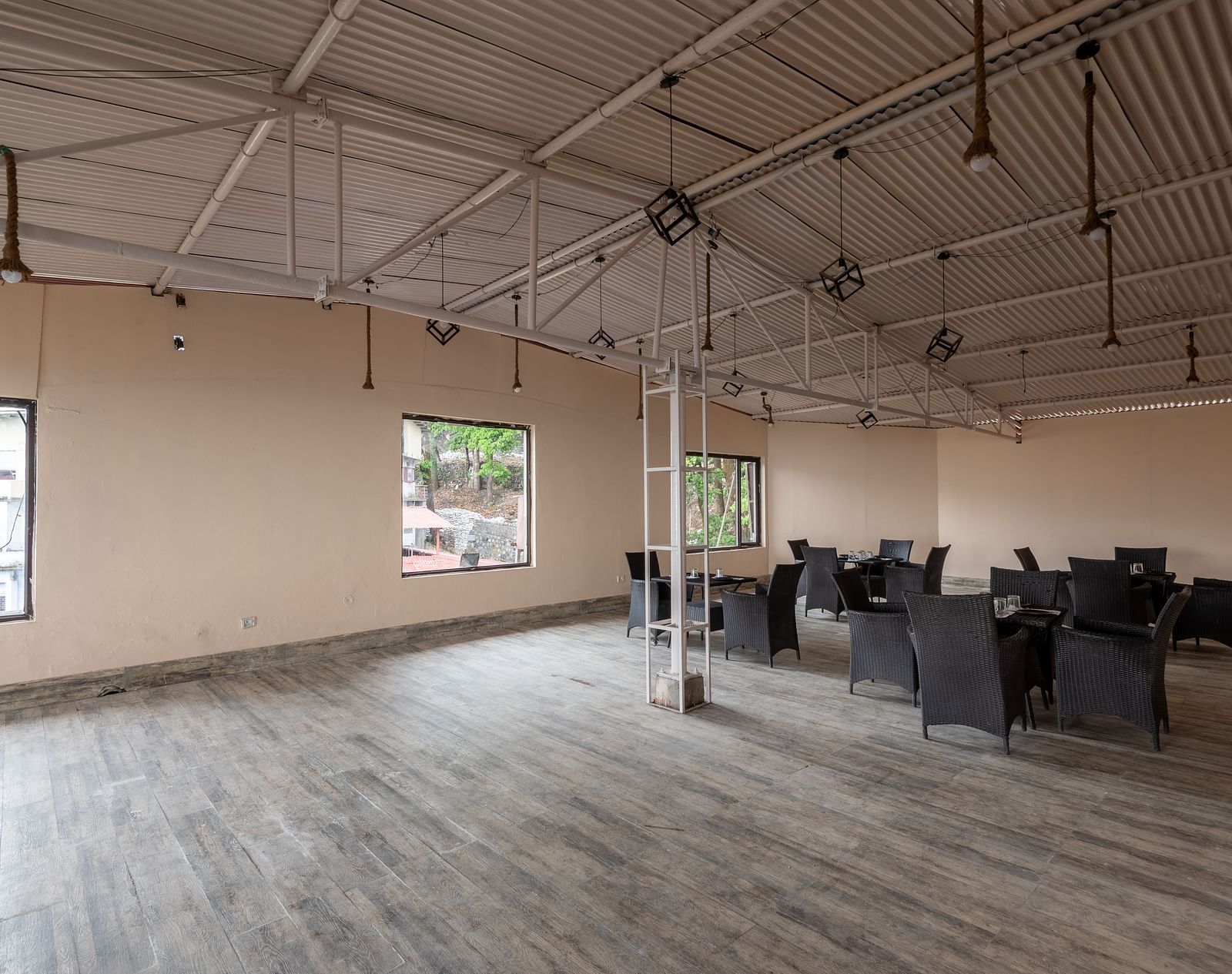 Image of the event hall with some chairs arranged in one side | DLS The Pearl