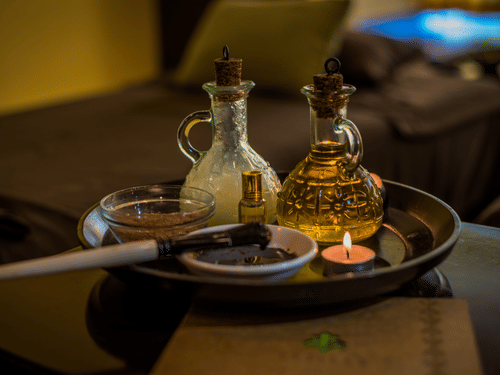 A close up of the essential oils kept on the table for a massage session at Oma Spa at The Serai Chikmagalur.