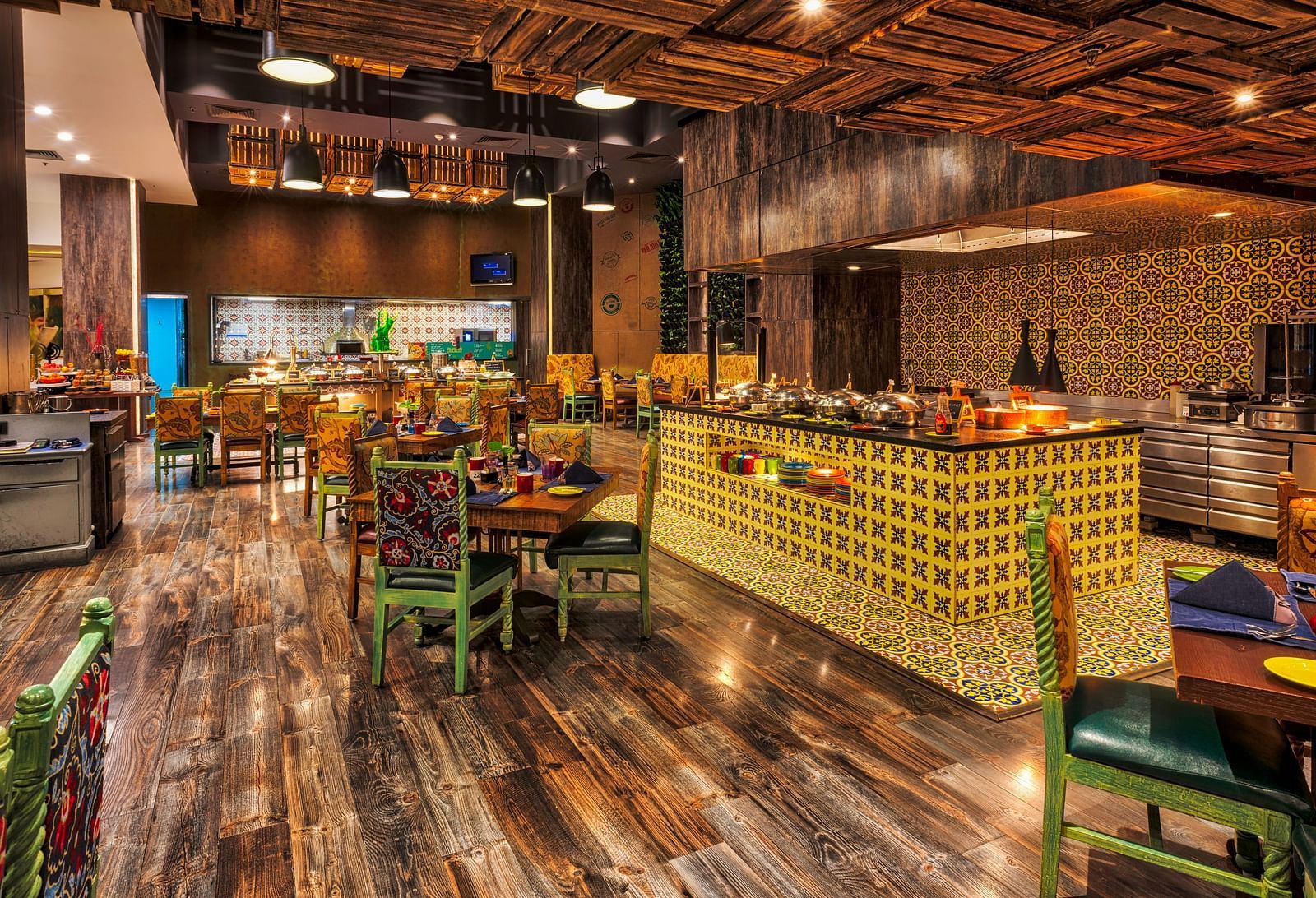 Seating arrangement of the restaurant at Grand Chennai By GRT Hotels.