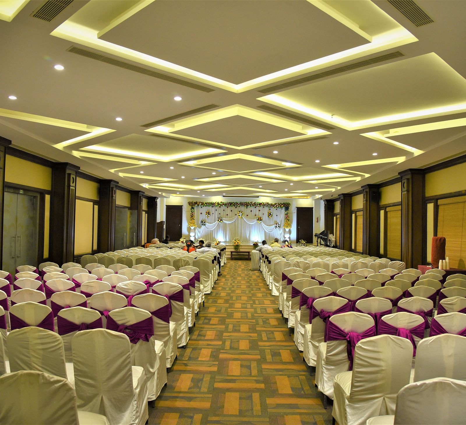rows of chairs placed at Crystal Banquet Hall at Hotel Atithi - TGI Grand, Pondicherry