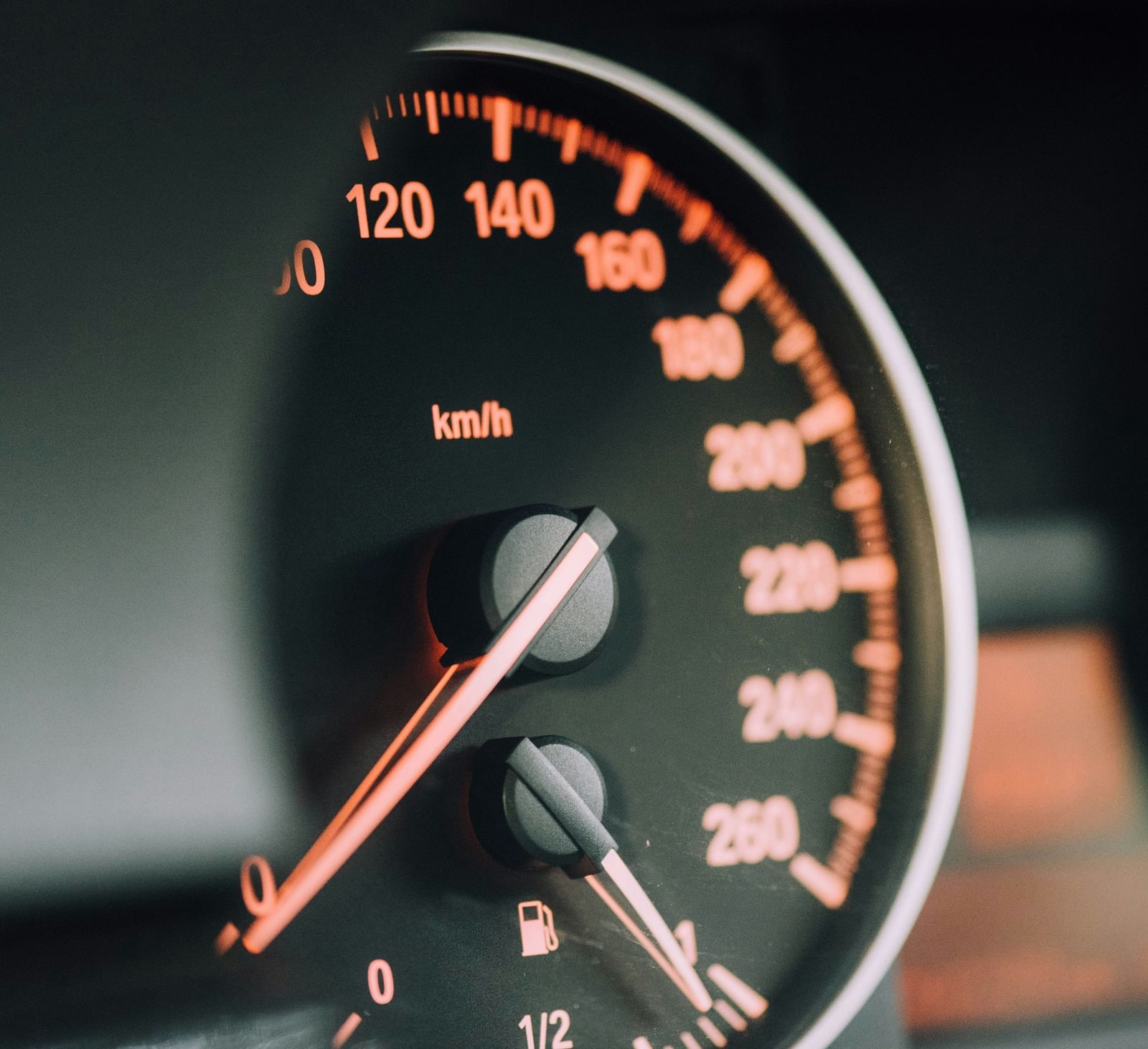 A close-up view of a car speedometer