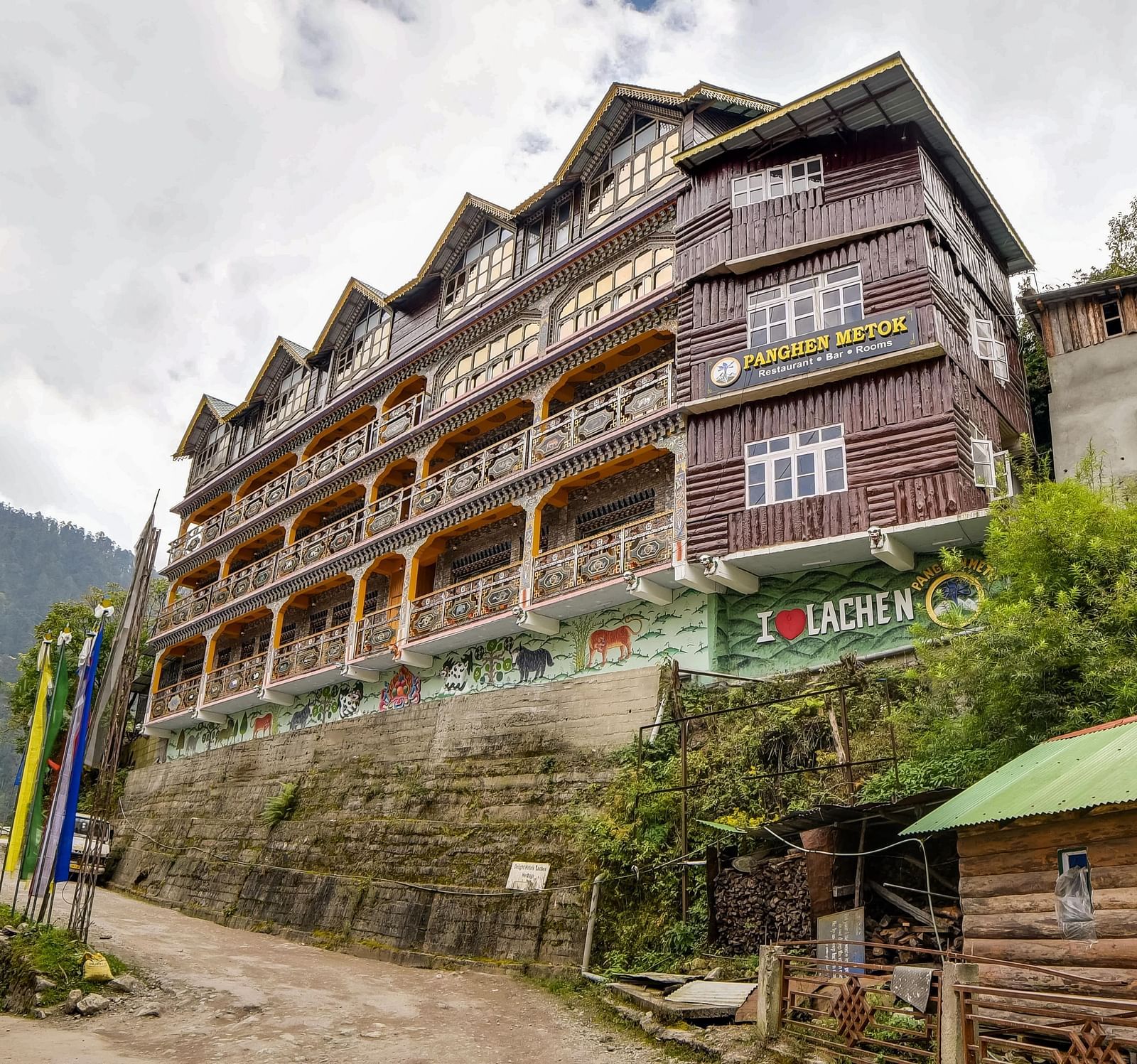 facade image in the morning view of the summit panghen metok hotel, lachen