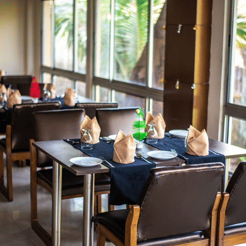 A neatly arrange dining area with a view of the outdoors