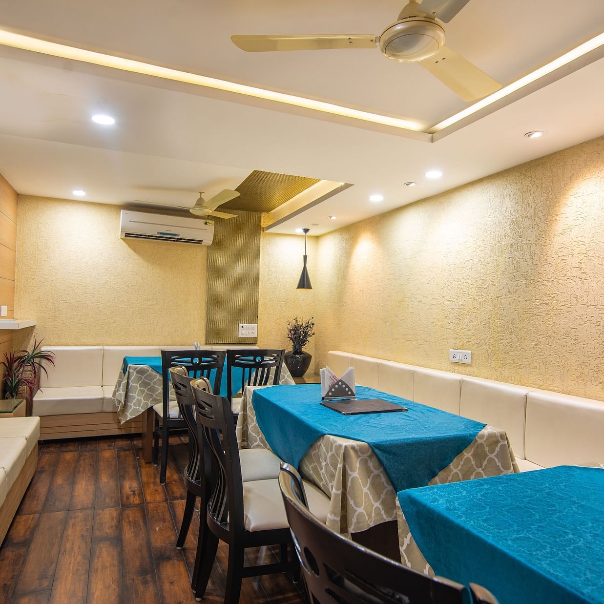 a dining area featuring a bunch of tables and chairs - Hotel Morya, Bhopal