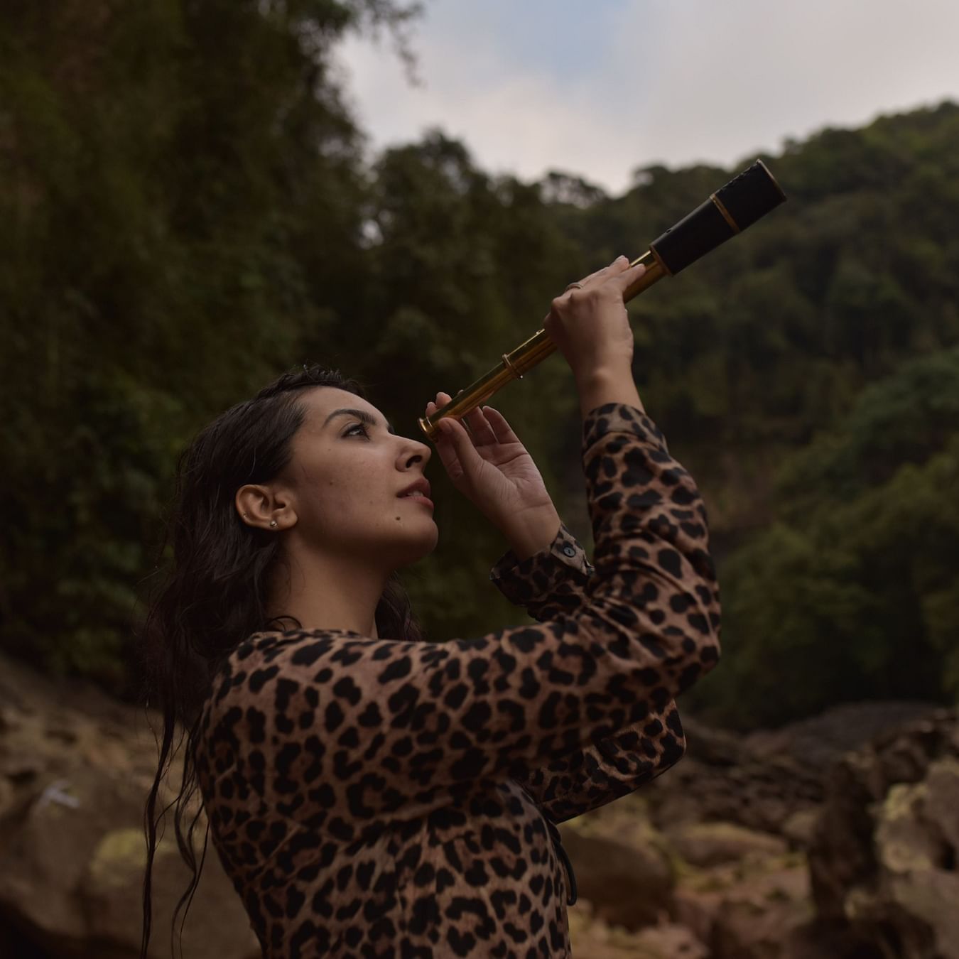 person looking through a monocular