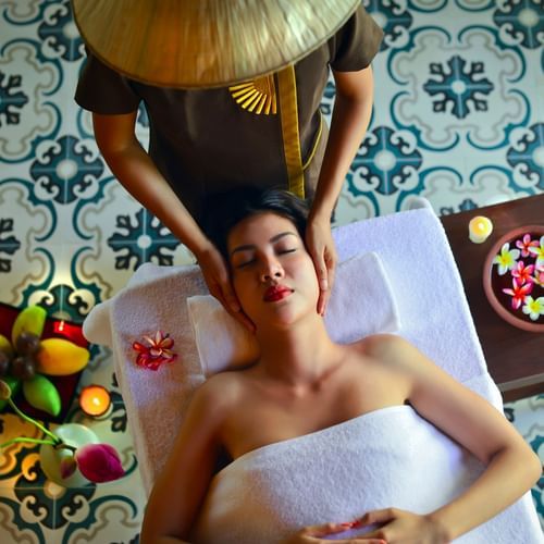 Woman receiving a face massage at a Spa