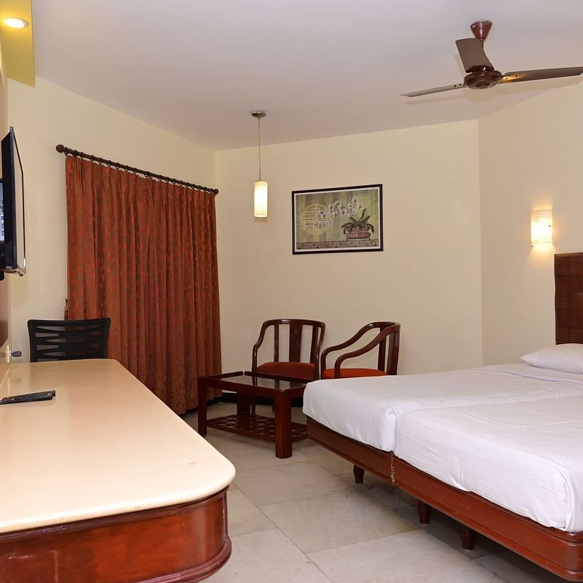 View of Standard Room for double occupancy with plush bed and basic amenities - Jayaram Hotel, Pondicherry