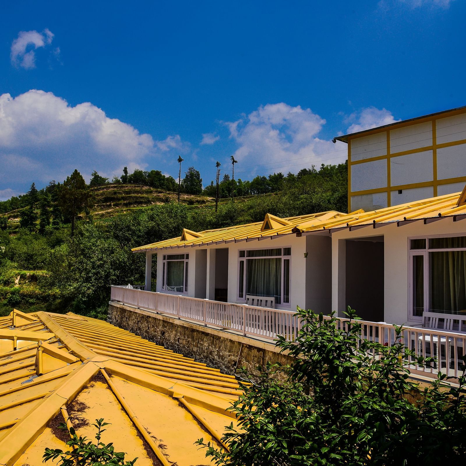A exterior view of the Te Aroha by Shervani, Mukteshwar with mountain backdrop