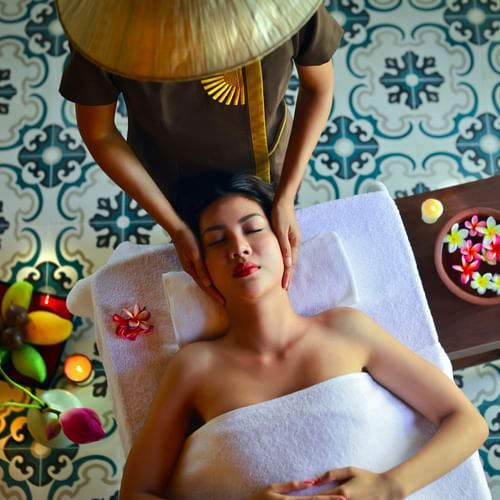 Woman receiving a face massage at a Spa