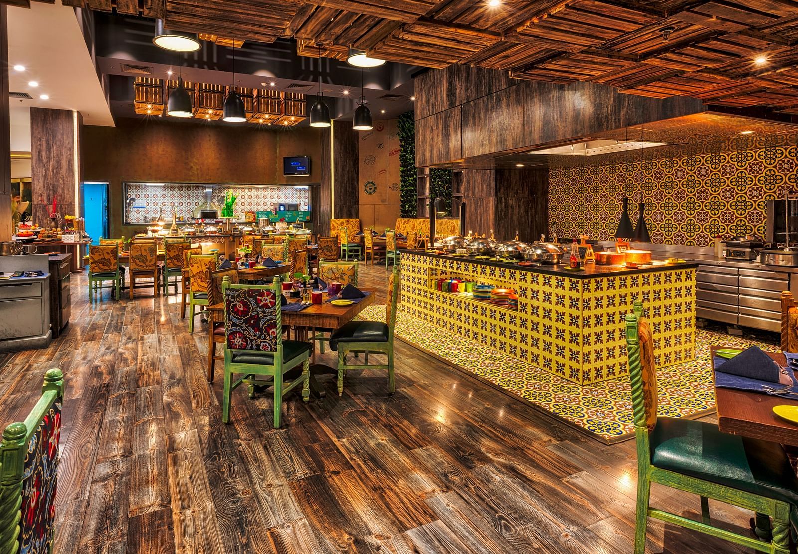 Seating arrangement of the restaurant at Grand Chennai By GRT Hotels.