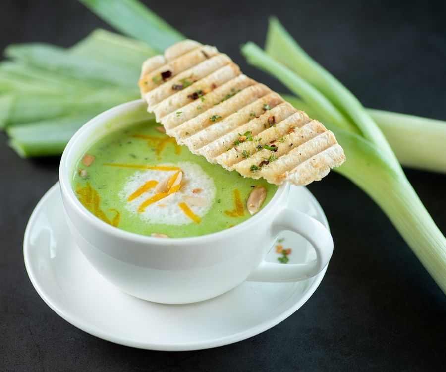 a bowl of green soup - polo floatel kolkata