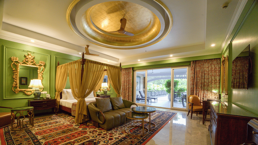 Spacious suite interior with ornate ceiling and sitting area at MAYFAIR Oasis Resort and Convention Jharsuguda