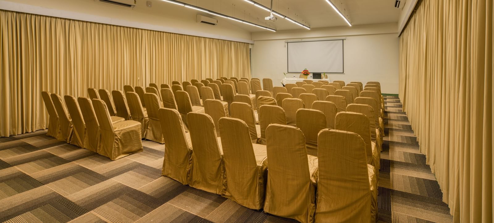Side view of Banquet hall with  golden chairs.