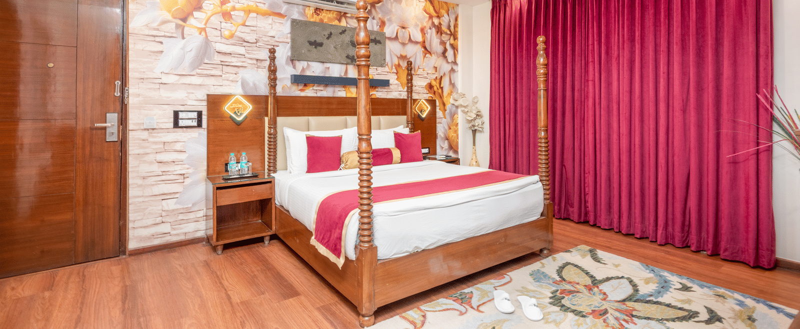 Double bed room with artistic wall décor at DLS Hotels On The Ganges.