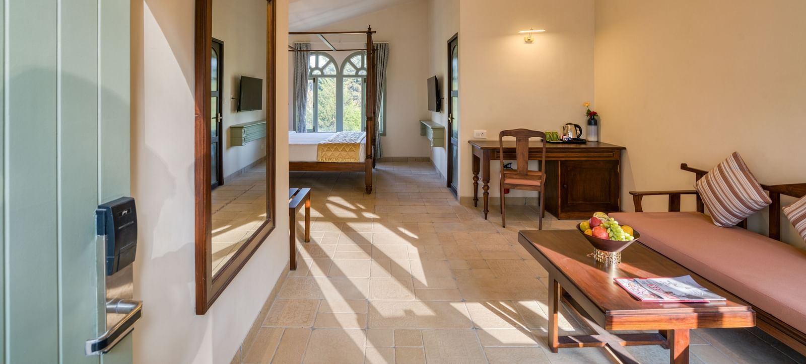 Overview of the living room with sofas inside deluxe room | Mango Hill Shola Ooty