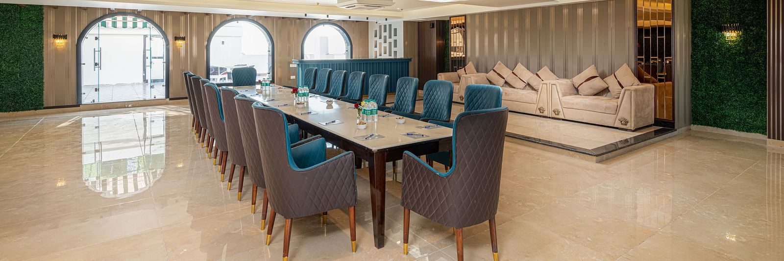 Image of the banquet hall with chairs and tale set up in a boardroom setting - DLS Grand Luxotica, Dehradun