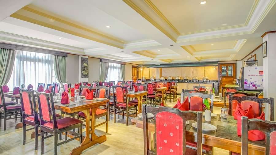 Image of a dining area with chiars and tables neately arranged at Summit Tashi Ghang Heritage Resort, Pelling
