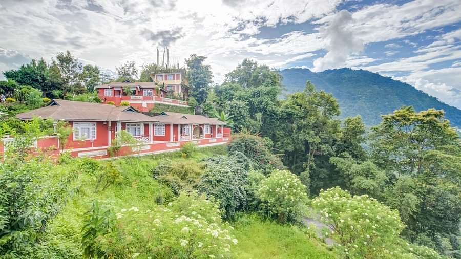 facade of Summit Tashi Ghang Heritage Resort, Pelling surrounded by greenery