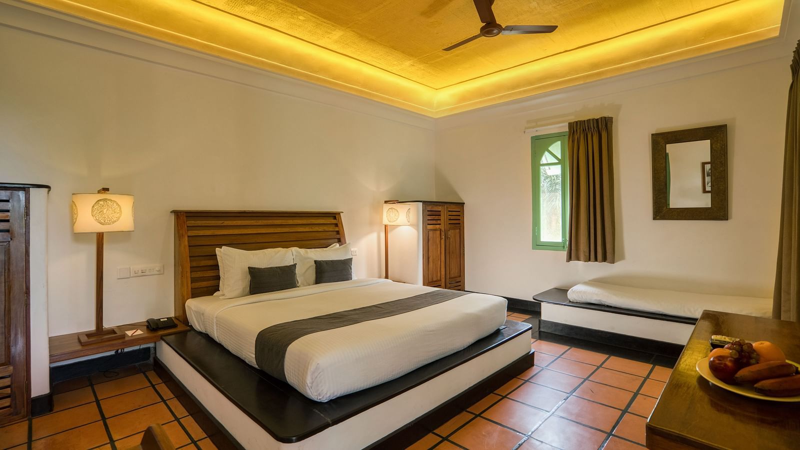Suite Bedroom with a bed, table and a sofa.