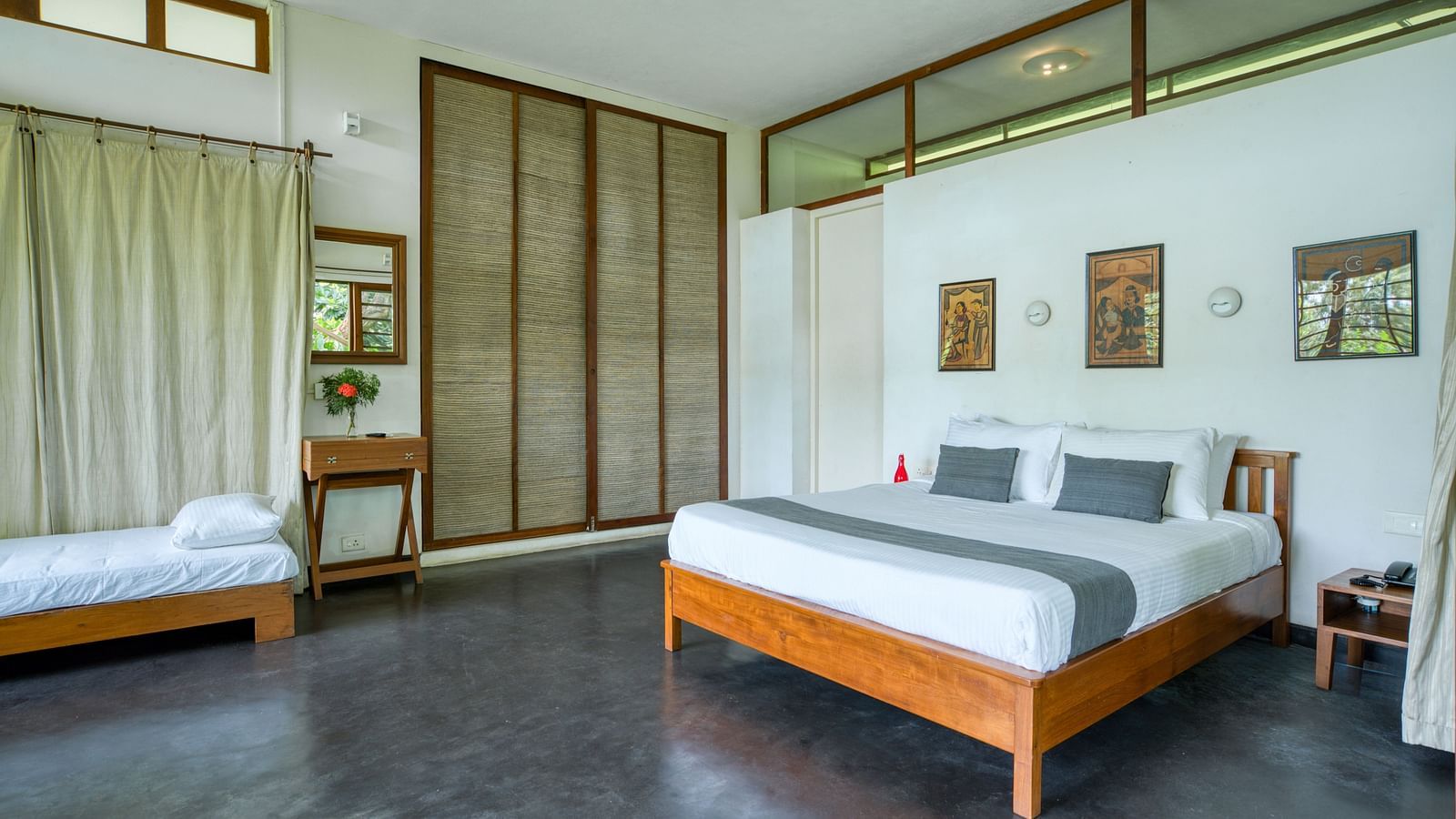 Villa with amle natural lighting and additional single bed cum diwaan for accommodating extra guests.