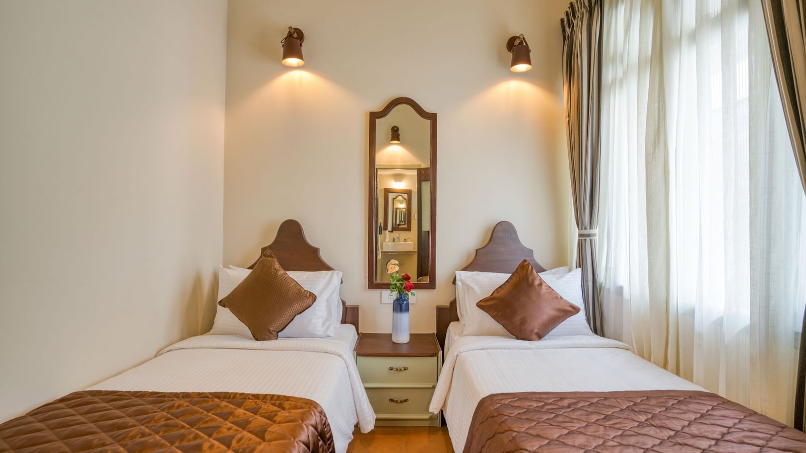 Twin beds inside the bedroom villa with a balcony | Mango Hill Shola Ooty