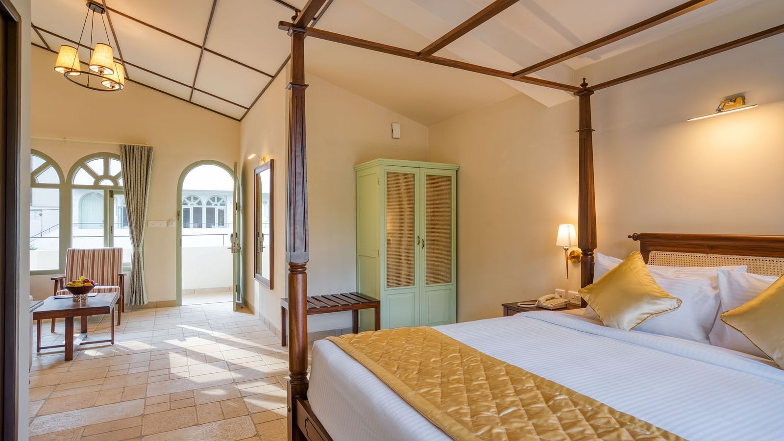 A close up shot of the double bed with golden runner and pillows | Mango Hill Shola Ooty