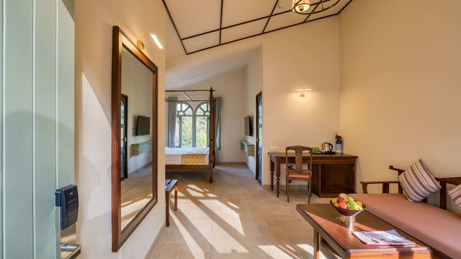 Overview of the living room with sofas inside deluxe room | Mango Hill Shola Ooty
