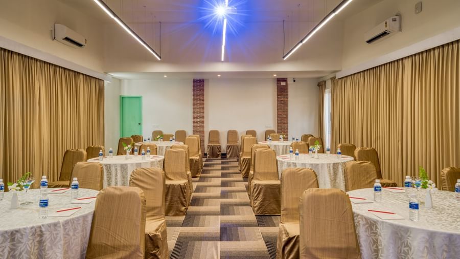 Banquet hall with table and chairs.