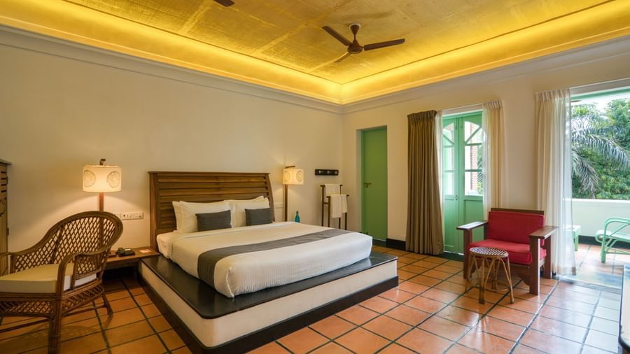 French Classic Bedroom with balcony and chair.