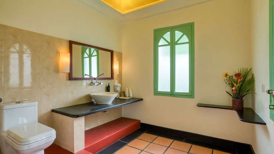 French Classic Washroom with washbasin, mirror and toilet.