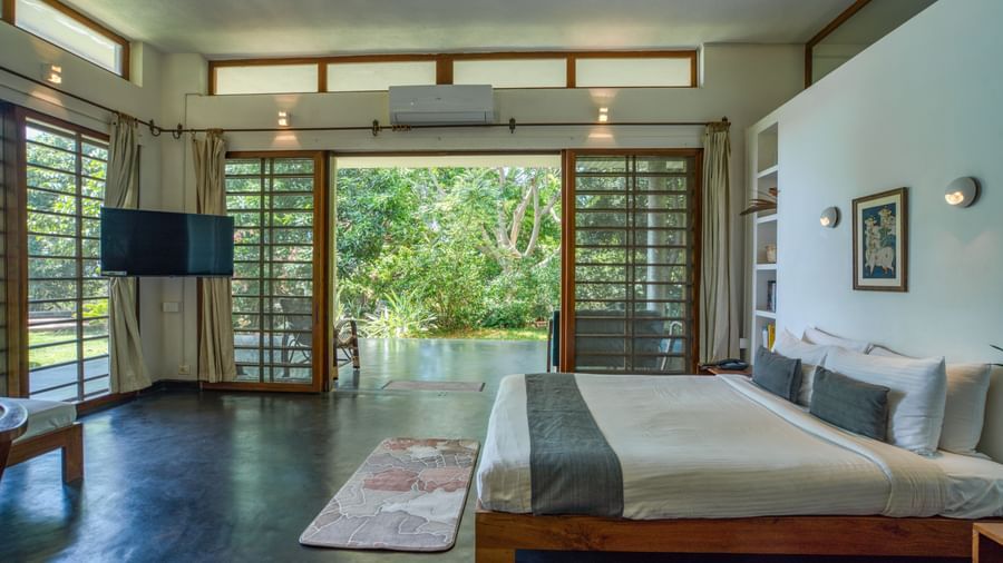 Bright and airy living room with comfortable seating and direct access to the pool.