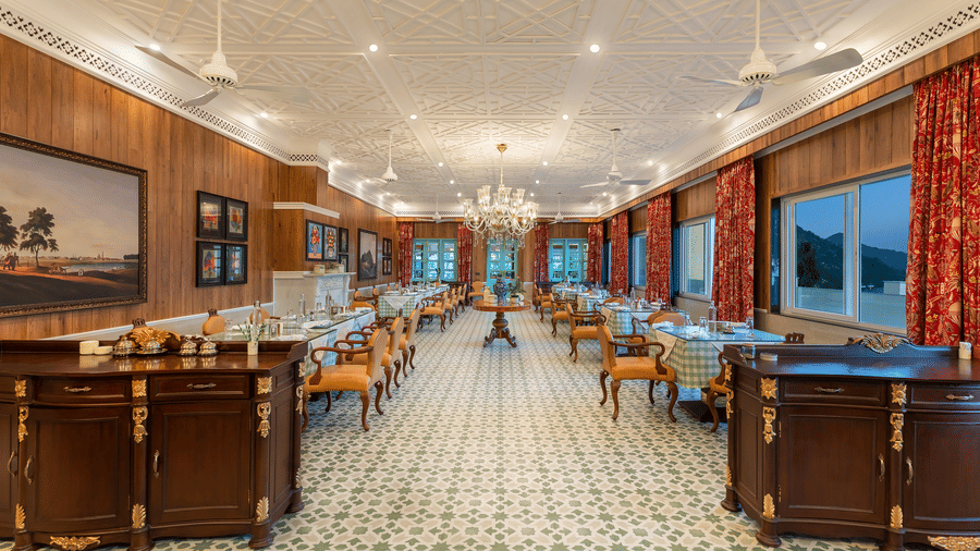 Spacious main restaurant hall with traditional decor at Mayfair Manor, Jungpana.