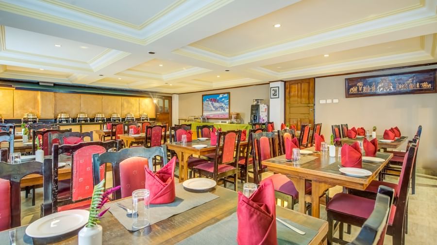 Image of a dining area with chairs and tables at Summit Tashi Ghang Heritage Resort, Pelling