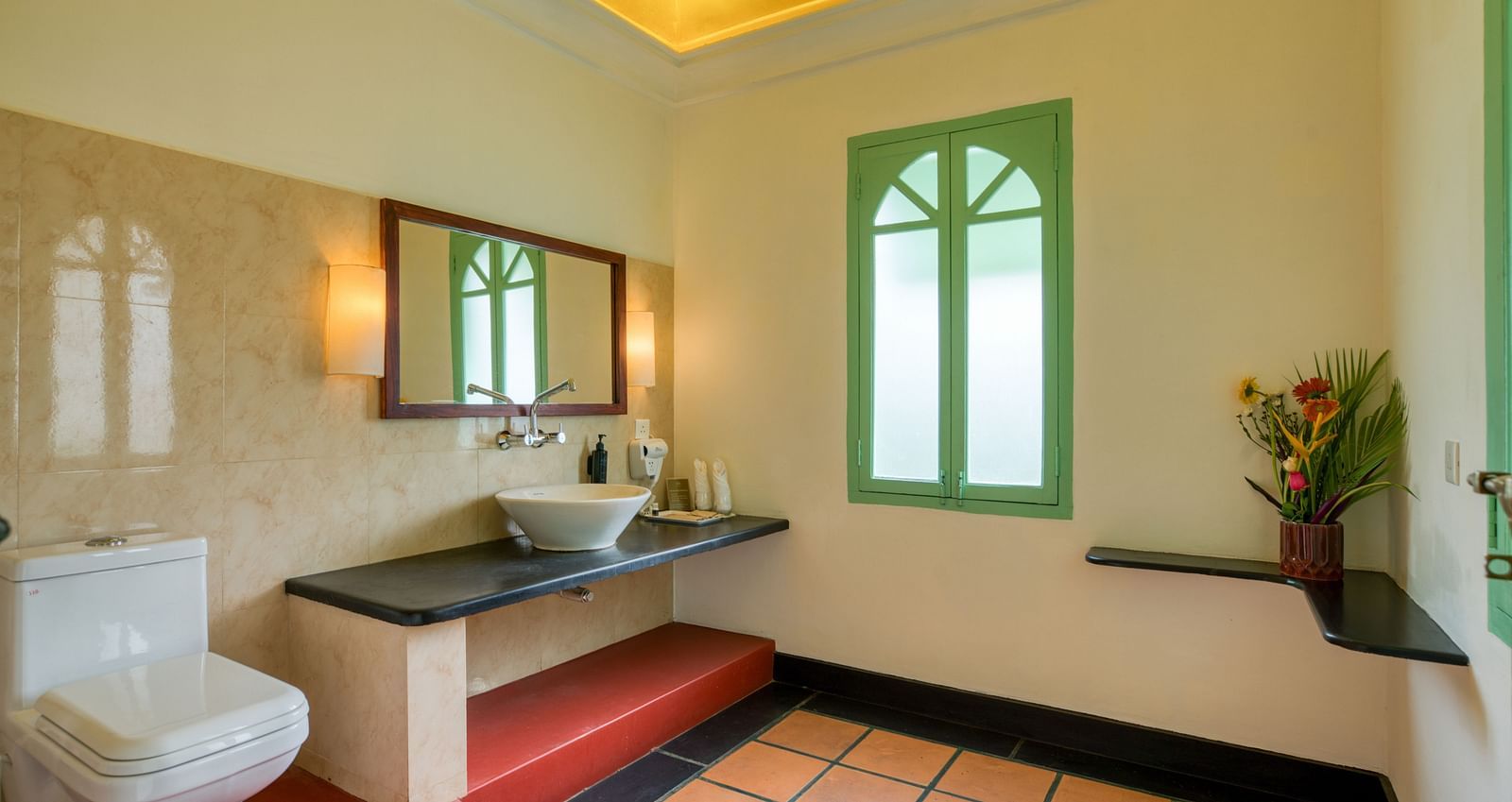 French Classic Washroom with washbasin, mirror and toilet.